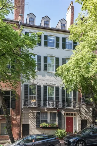 front view of a building with a garden