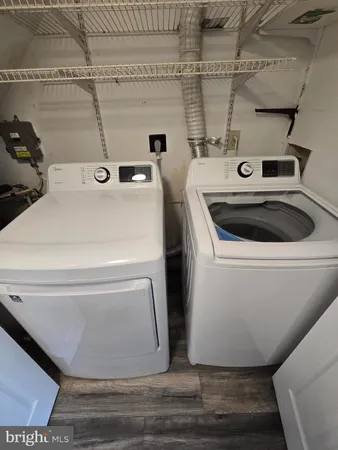 a utility room with washer and dryer