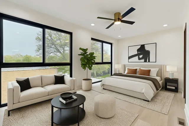 a bedroom with a large bed and a large window