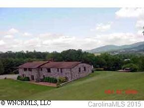 117 Jones Road Leicester, NC 28748 - Photo 1 of 9 a view of a big yard with potted plants and large trees