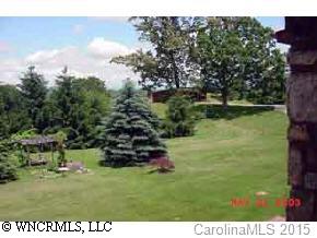 117 Jones Road Leicester, NC 28748 - Photo 2 of 9 a backyard of a house with lots of green space