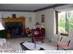 117 Jones Road Leicester, NC 28748 - Photo 3 of 9 a living room with furniture and a fireplace