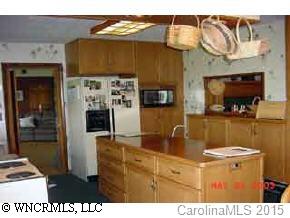 117 Jones Road Leicester, NC 28748 - Photo 5 of 9 a kitchen with a refrigerator and a stove top oven