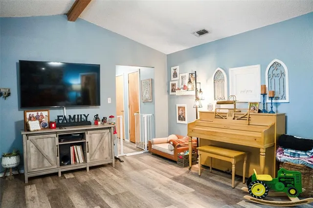 a living room with furniture and a window
