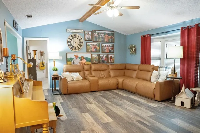 a dining room with furniture and wooden floor