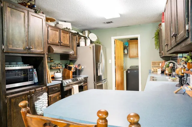 a kitchen with a sink and a cabinets
