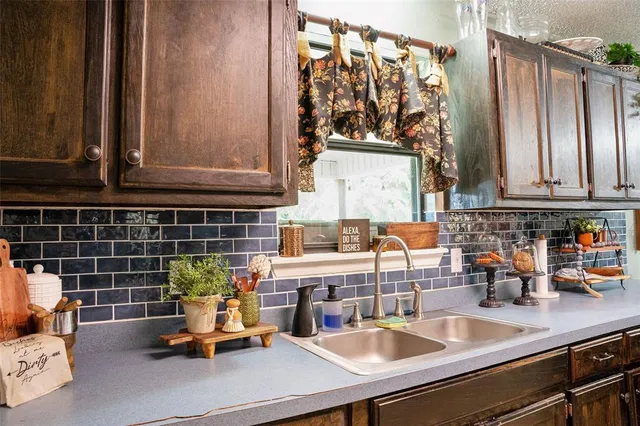 a kitchen with lots of counter top space and appliances