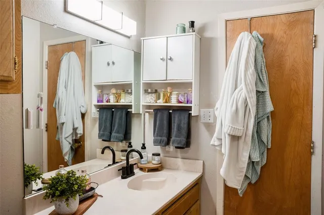 a bedroom with a bed and dresser