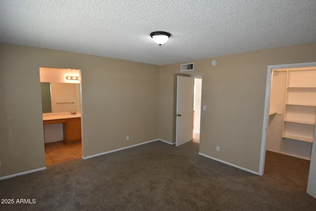 a view of an empty room and a window