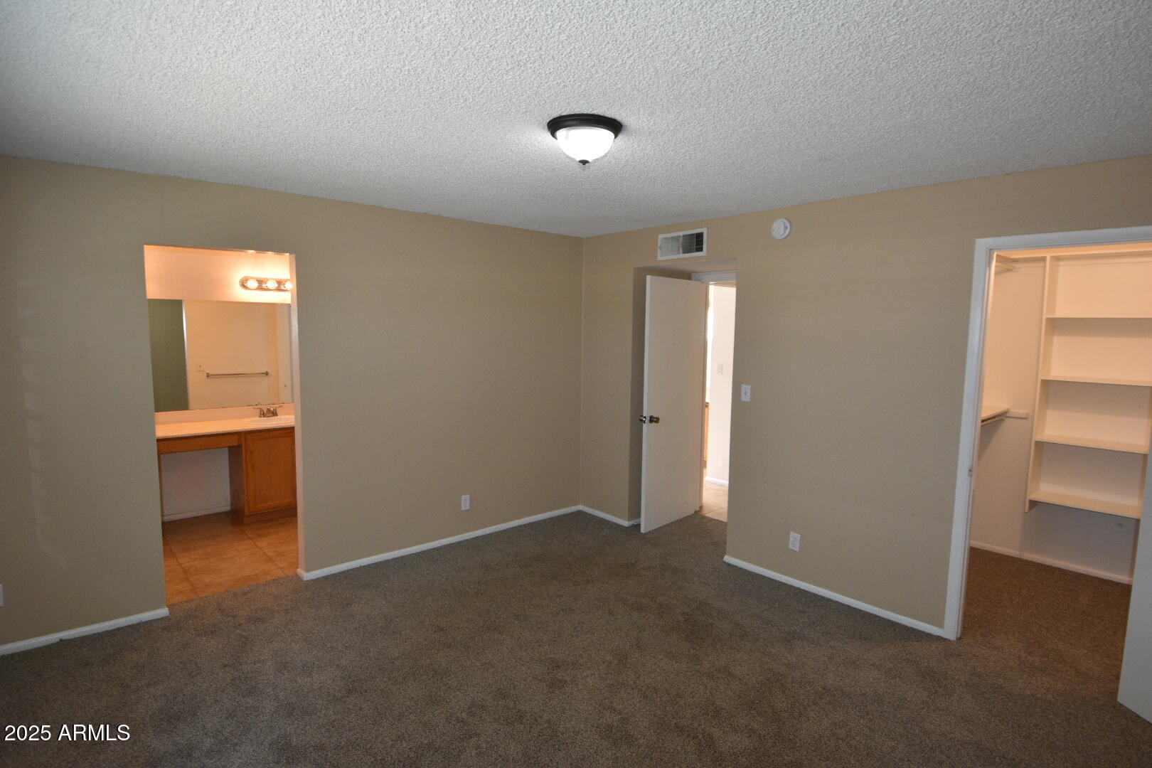 3720 West Purdue Avenue Phoenix, AZ 85051 - Photo 7 of 9 a view of an empty room and a window