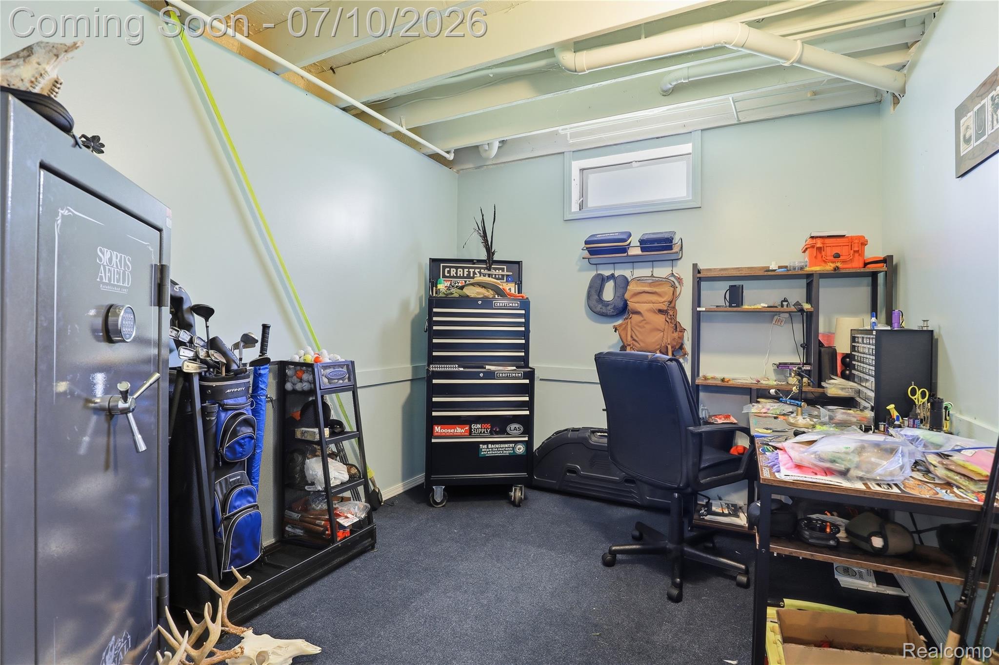 5275 East Maple Avenue Grand Blanc, MI 48439 - Photo 40 of 53 Flexible-use room featuring light blue walls, exposed white ceiling joists, and a small transom window