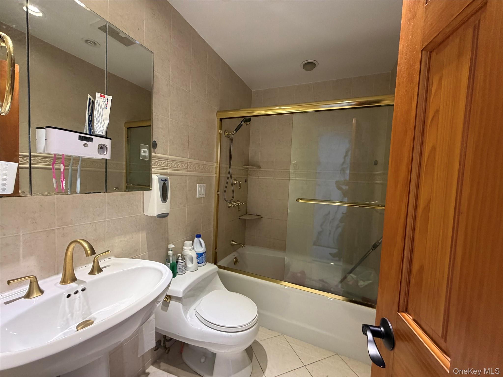 224-01 59th Avenue Queens, NY 11364 - Photo 8 of 13 a bathroom with a sink toilet and shower