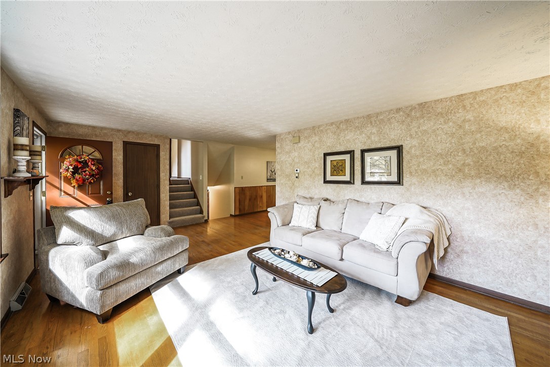 12464 Alpha Road Hiram, OH 44234 - Photo 5 of 33 Large living room with hardwood floors.