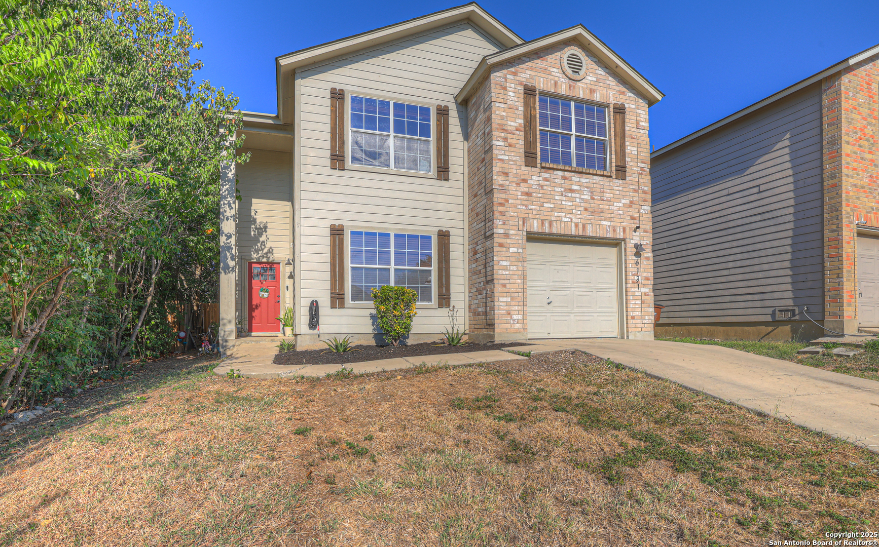 6131 Kensinger Pass Converse, TX 78109 - Photo 1 of 20 a front view of a house with a yard and garage