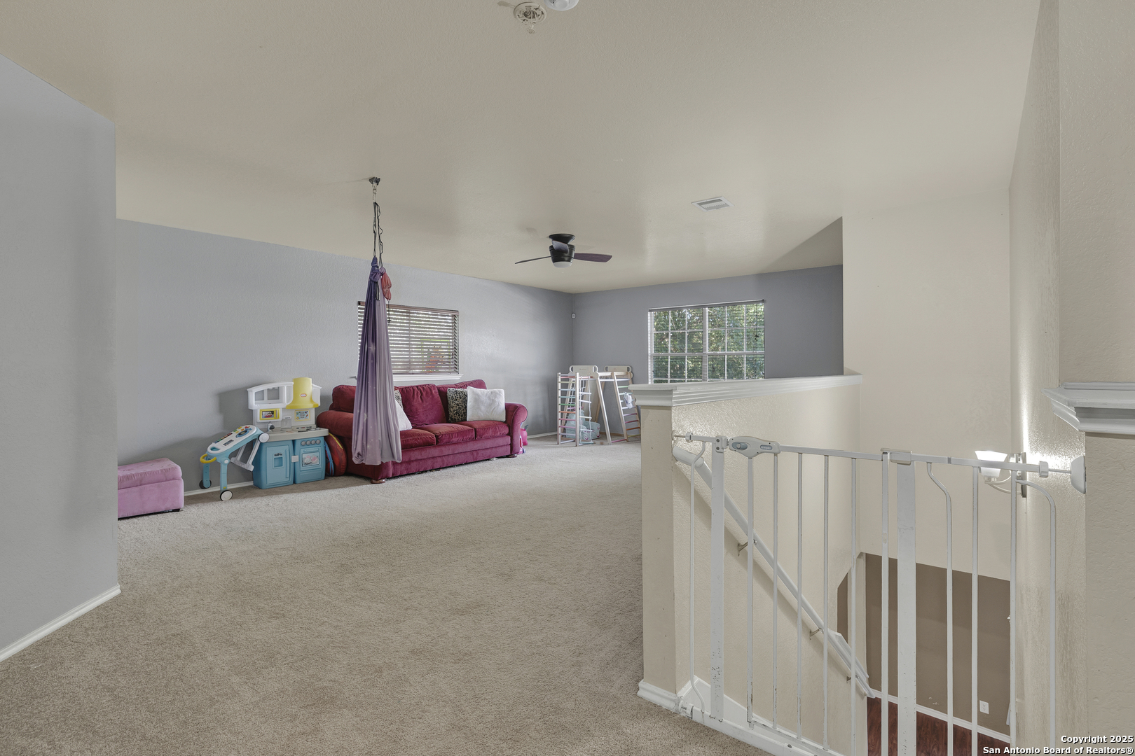 6131 Kensinger Pass Converse, TX 78109 - Photo 12 of 20 a bedroom with furniture and a chandelier