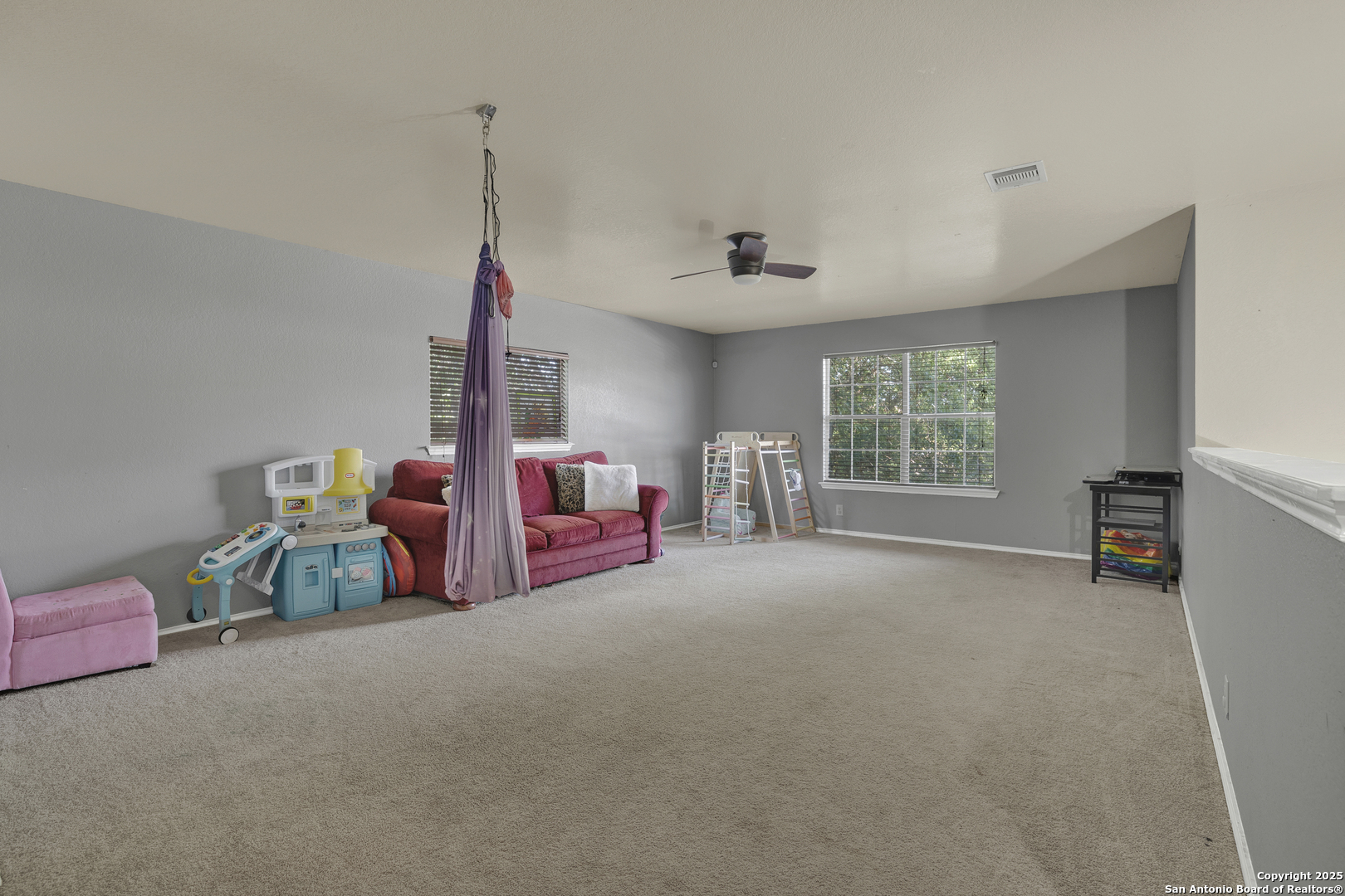6131 Kensinger Pass Converse, TX 78109 - Photo 13 of 20 a bed room with furniture and a window