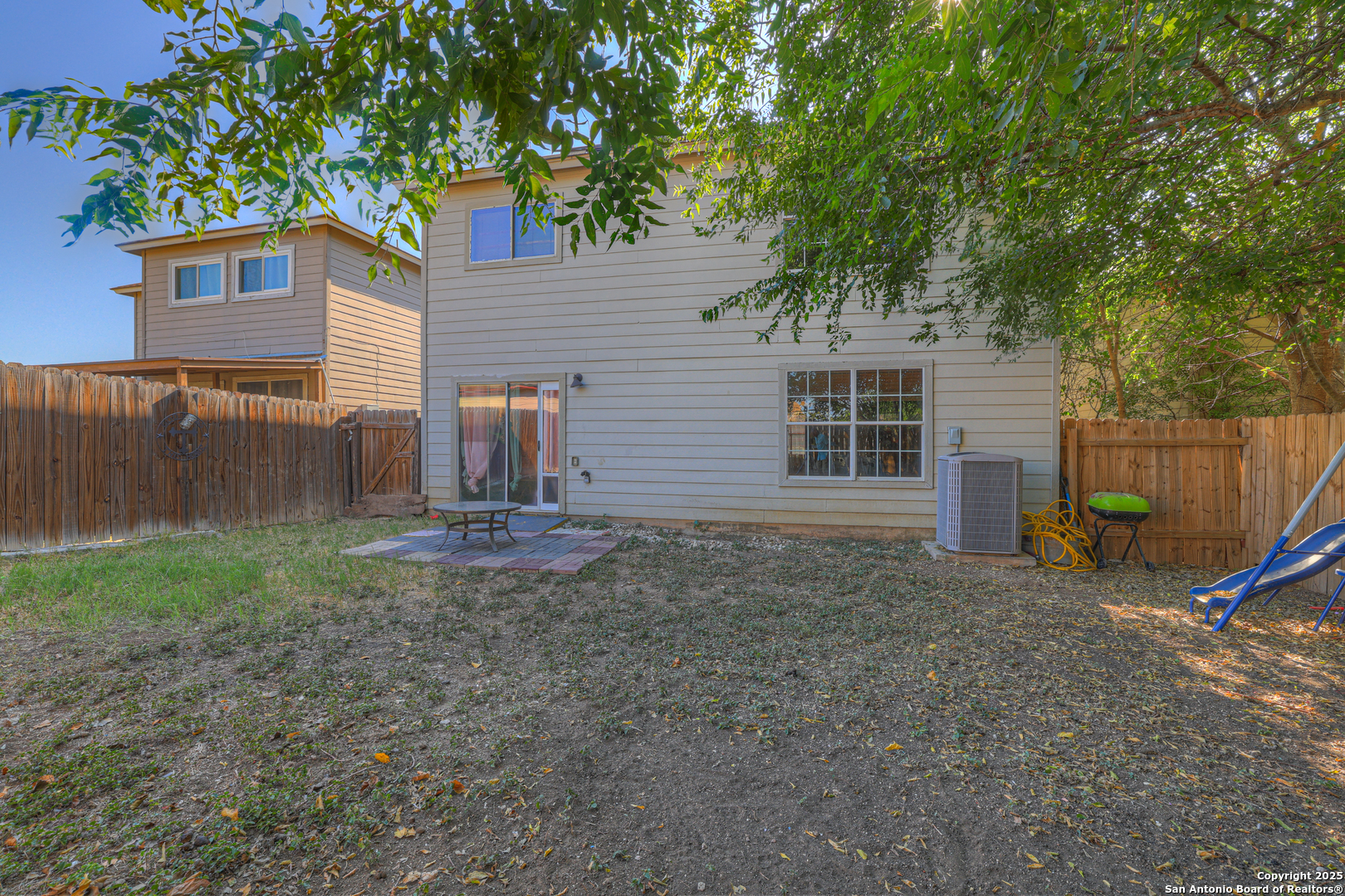 6131 Kensinger Pass Converse, TX 78109 - Photo 18 of 20 a view of a house with backyard and a tree