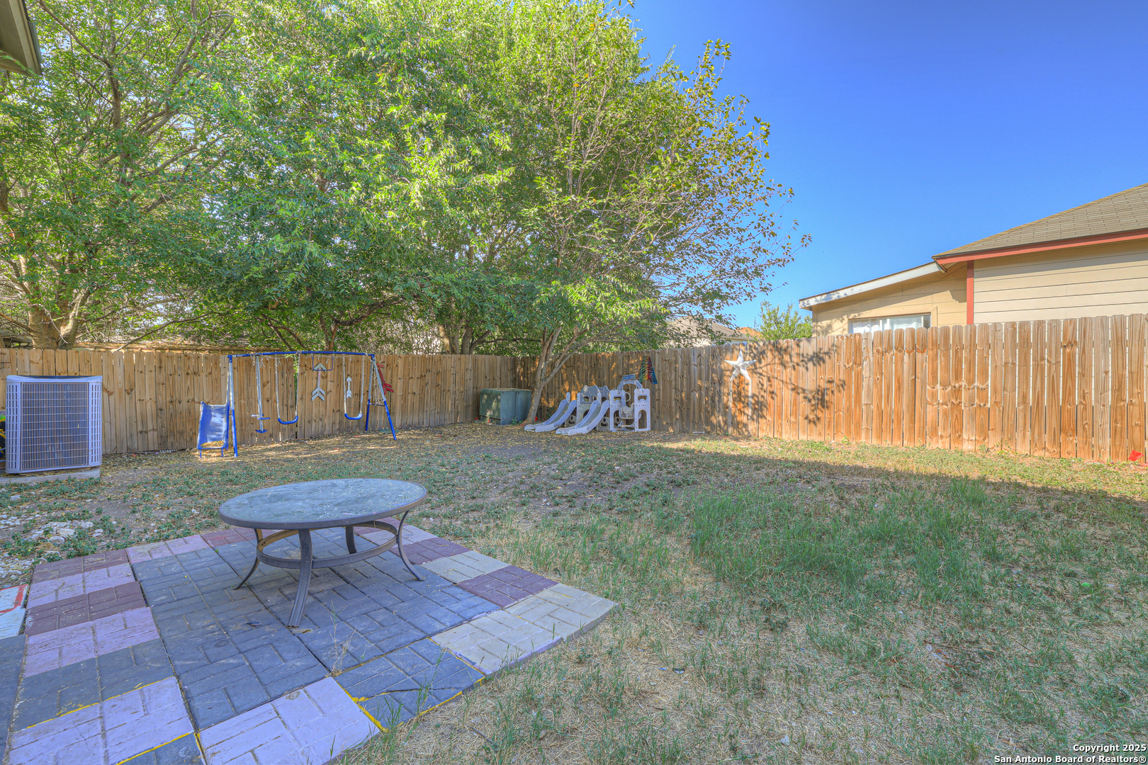 6131 Kensinger Pass Converse, TX 78109 - Photo 19 of 20 a view of a backyard with a patio