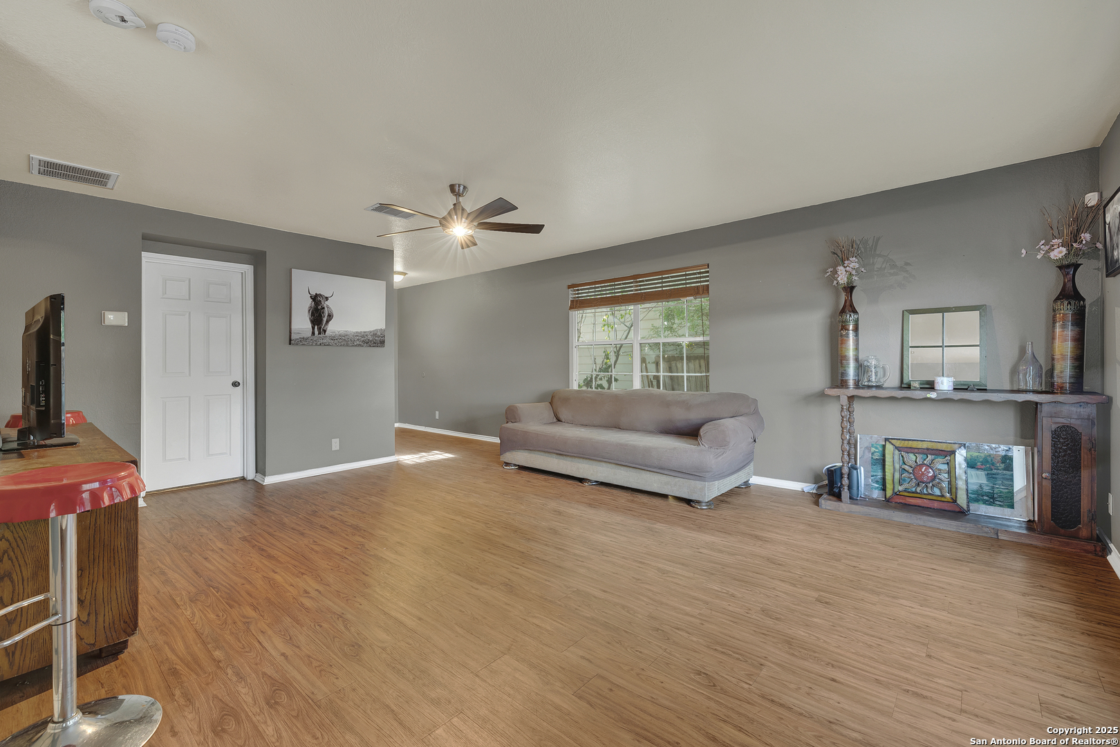 6131 Kensinger Pass Converse, TX 78109 - Photo 4 of 20 a living room with furniture and a fireplace