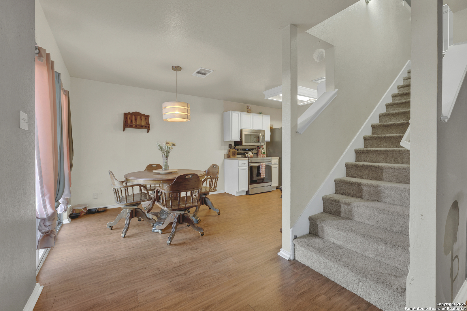 6131 Kensinger Pass Converse, TX 78109 - Photo 9 of 20 a view of a dining room with furniture and wooden floor