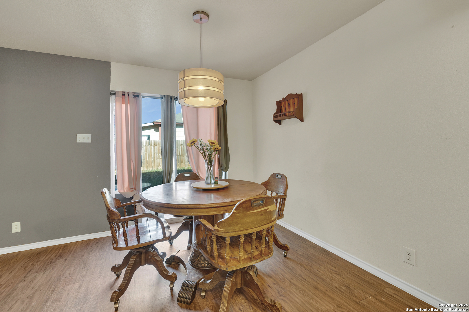 6131 Kensinger Pass Converse, TX 78109 - Photo 10 of 20 a view of a dining room with furniture and wooden floor