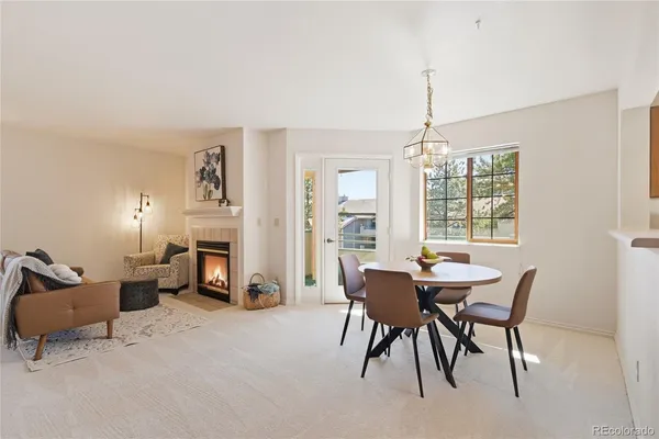 a view of a livingroom with furniture and a fireplace