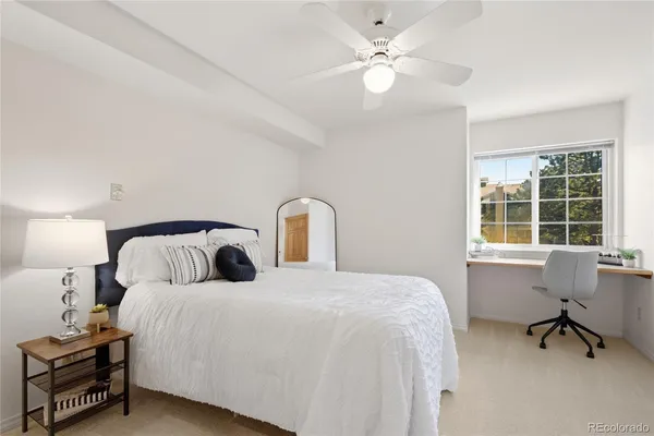 a bedroom with bed and a window