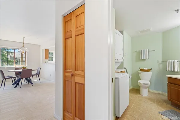 a bathroom with a toilet sink and a mirror