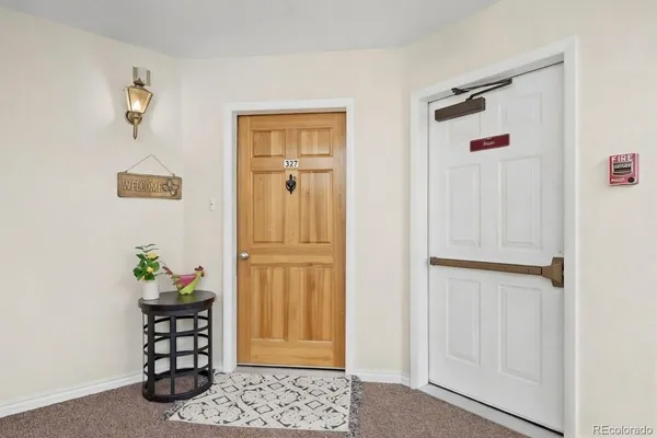 a view of entryway with wooden floor