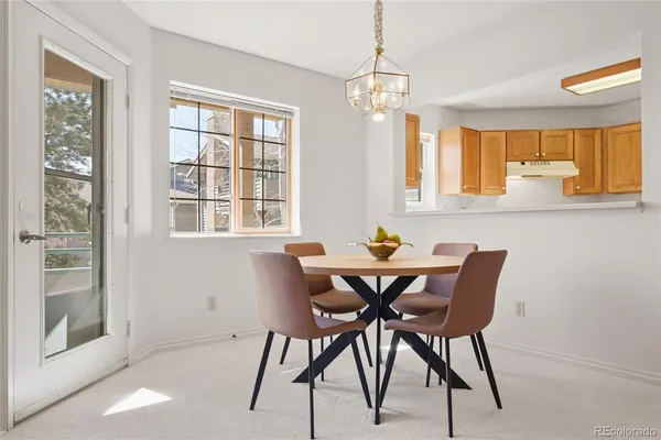 a view of a dining room with furniture and window