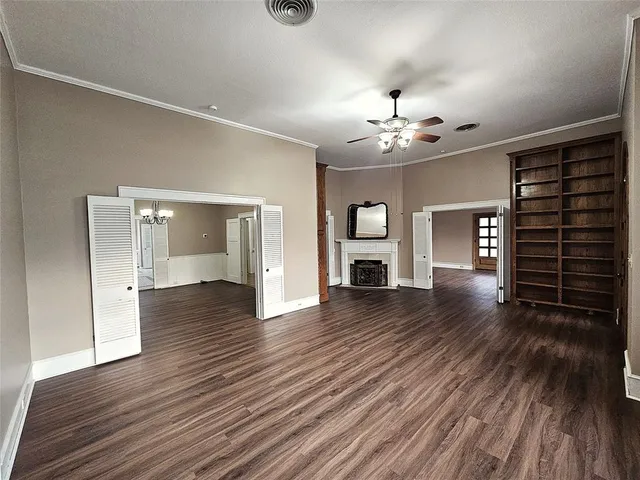 a view of living room with hardwood floor and windows