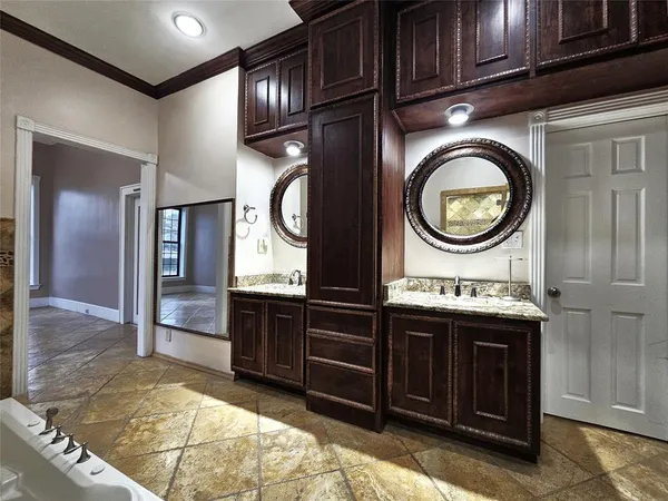 a bathroom with a bathtub and shower