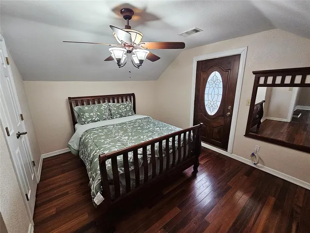 a view of a roof deck with chair and wooden floor