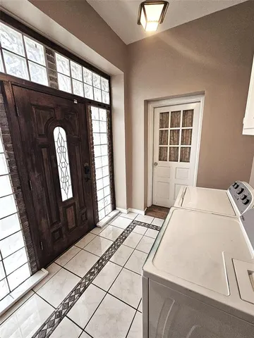 a view of a house with backyard and a garden