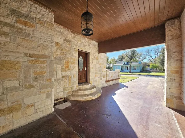 a view of an entryway with garden