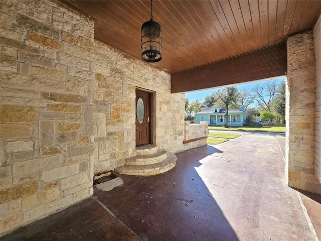 a view of an entryway with garden