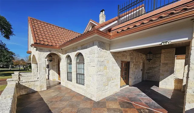 a front view of a house with large windows
