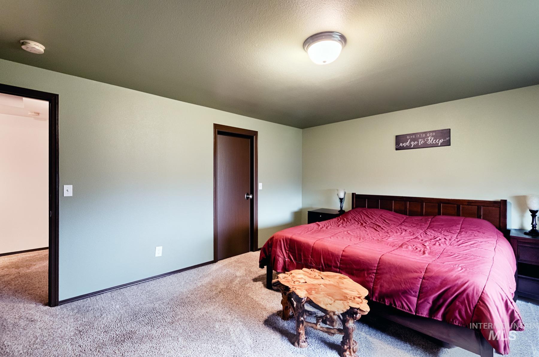 7500 Pleasant View Drive Caldwell, ID 83607 - Photo 10 of 43 Carpeted bedroom featuring baseboards