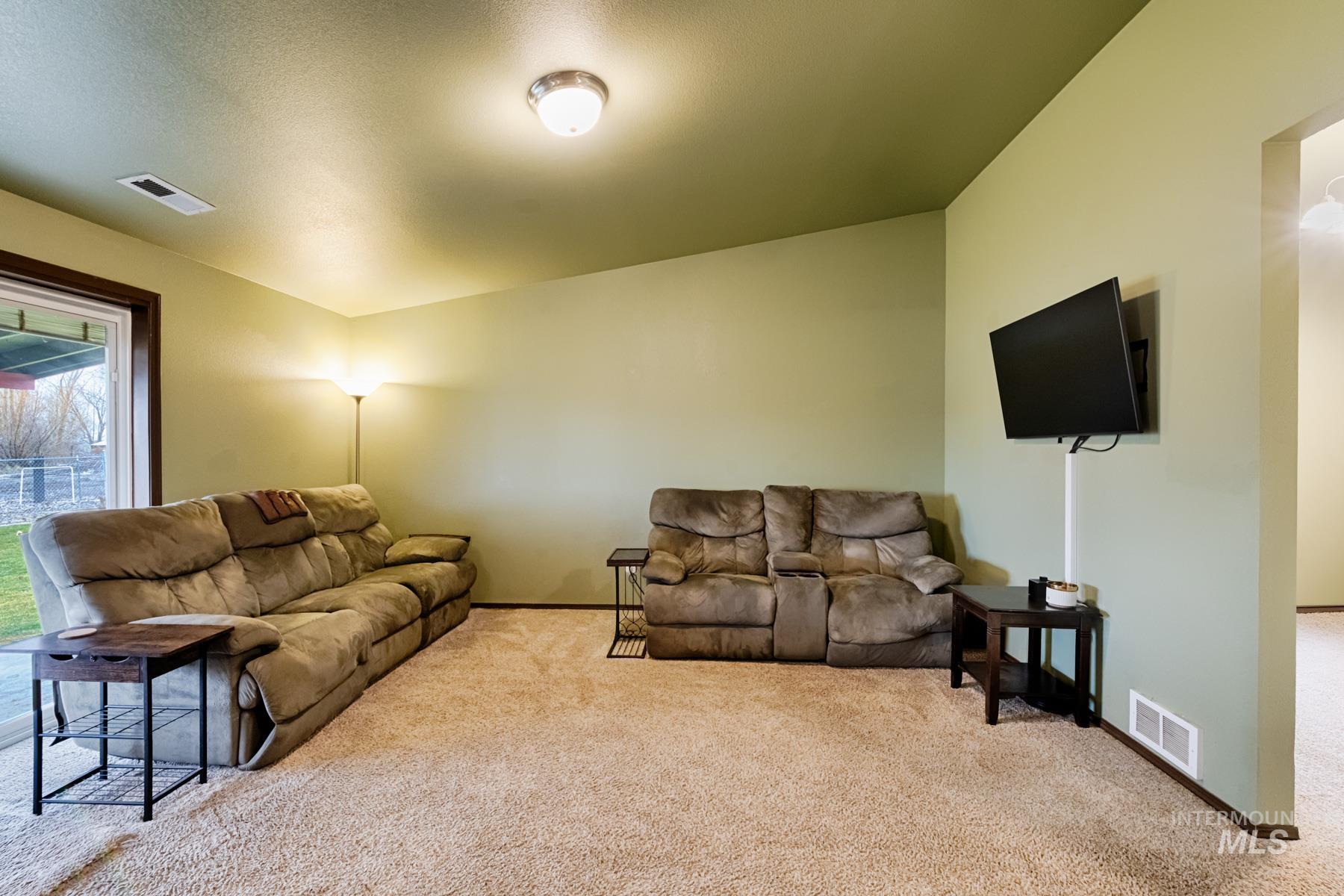 7500 Pleasant View Drive Caldwell, ID 83607 - Photo 15 of 43 Living room featuring light colored carpet