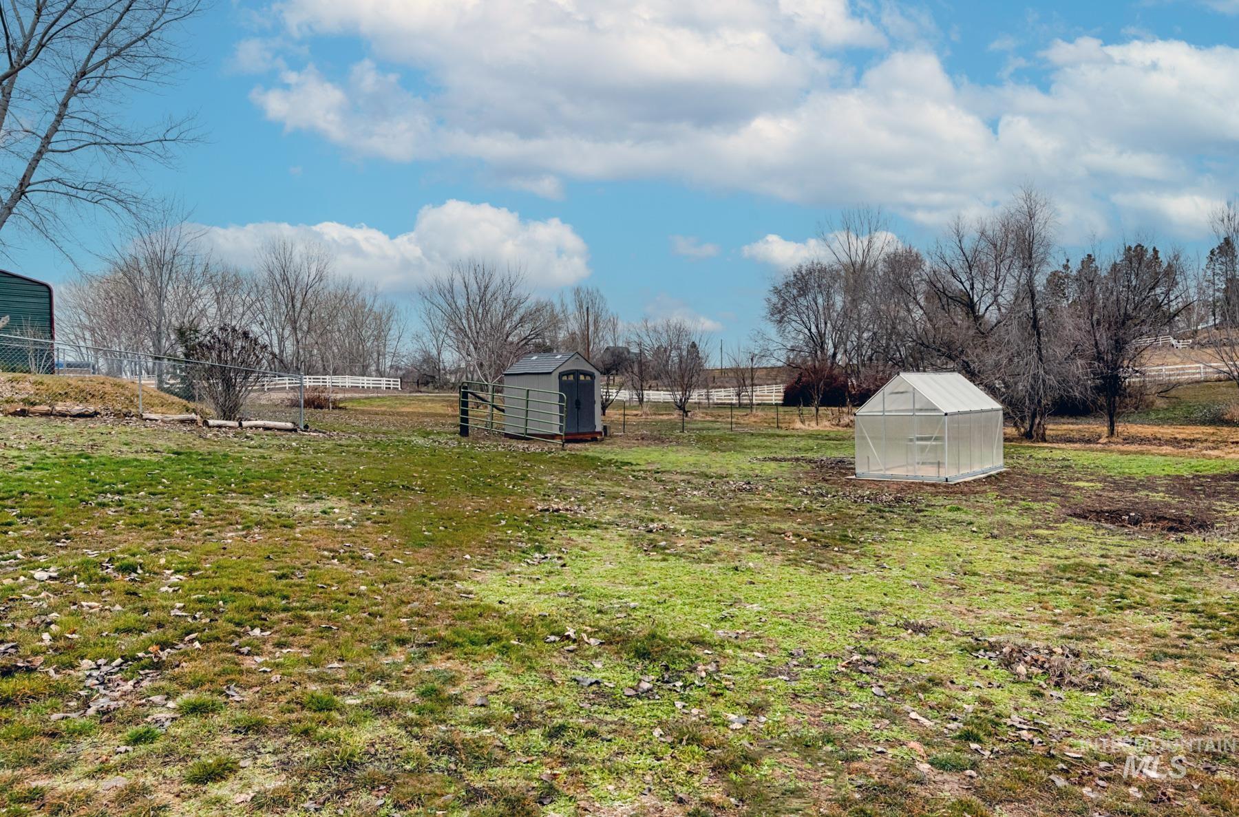 7500 Pleasant View Drive Caldwell, ID 83607 - Photo 20 of 43 View of yard featuring a storage unit, an exterior structure, and a view of rural / pastoral area