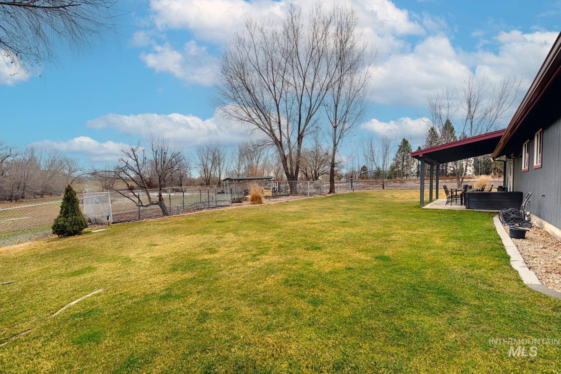 7500 Pleasant View Drive Caldwell, ID 83607 - Photo 37 of 43 Fenced backyard with a patio area