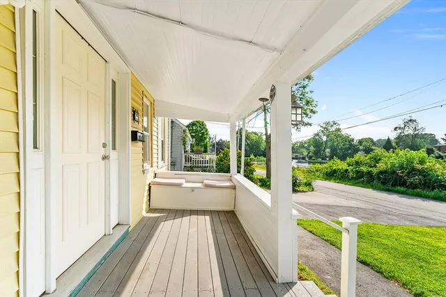 a view of a patio with wooden floor and outer view