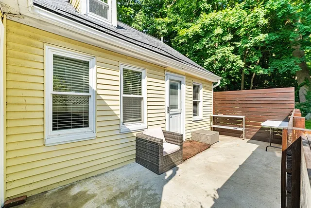 a view of a two chairs in the back yard