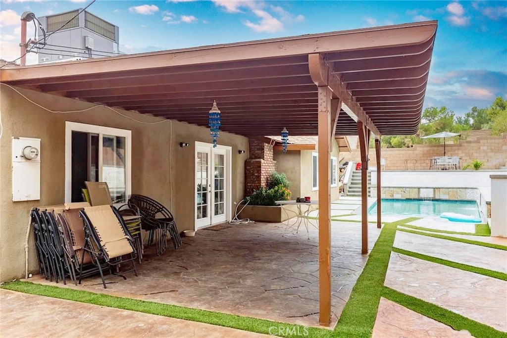 38603 Sage Tree Street Palmdale, CA 93551 - Photo 17 of 17 a view of a patio with table and chairs