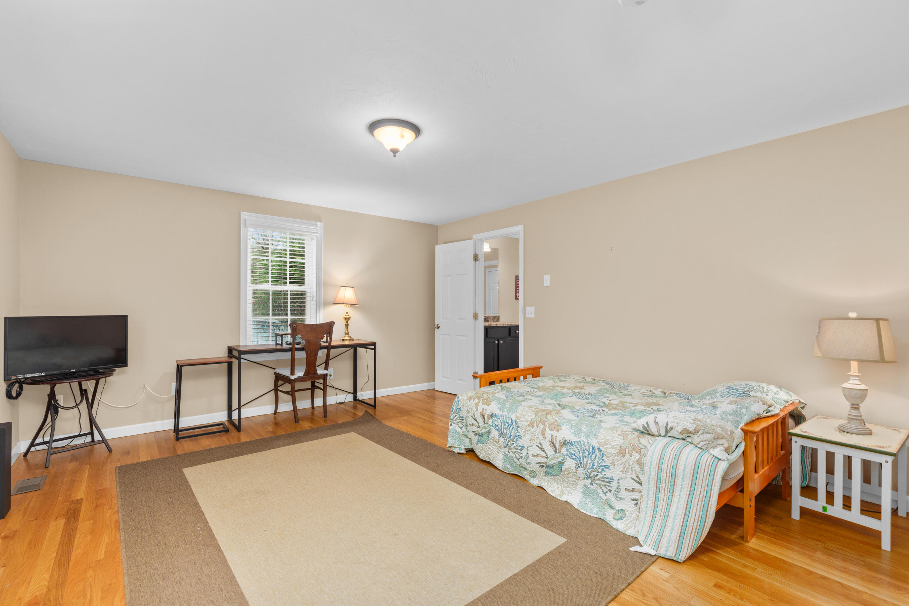 5 Baker Road Wellfleet, MA 02667 - Photo 16 of 30 a bedroom with a bed and a table in it