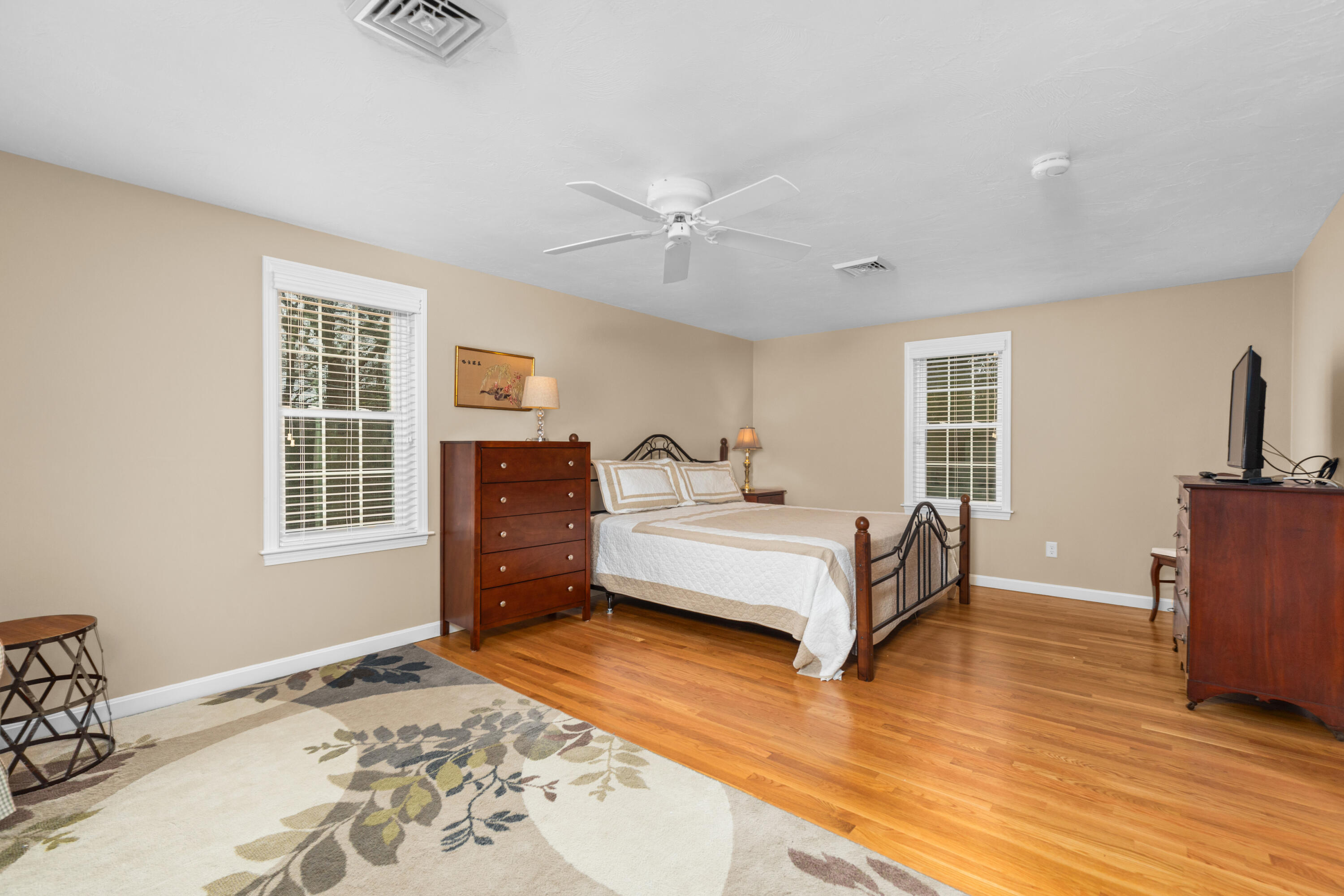 5 Baker Road Wellfleet, MA 02667 - Photo 20 of 30 a bedroom with a bed and wooden floor