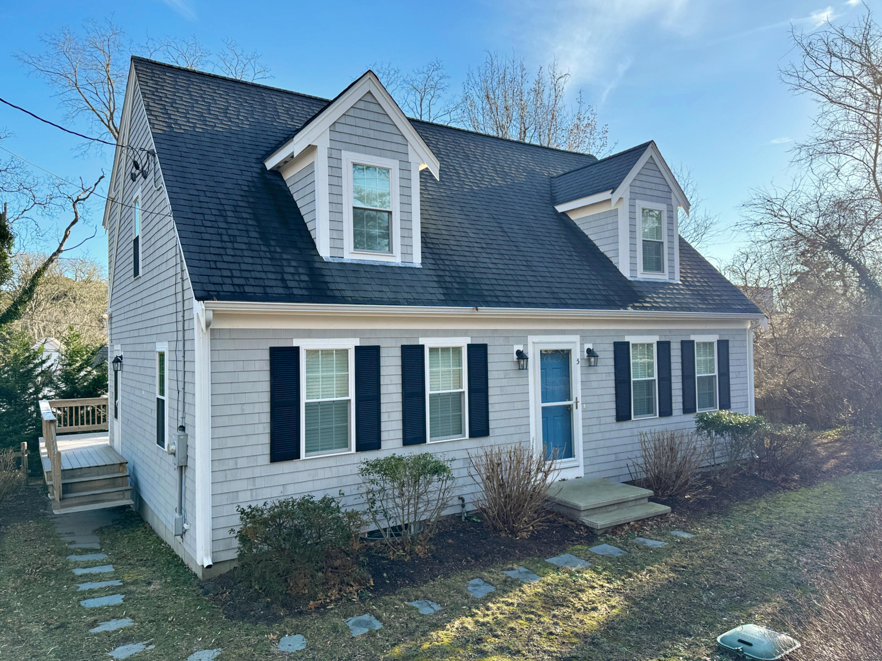 5 Baker Road Wellfleet, MA 02667 - Photo 2 of 30 a front view of a house with a yard