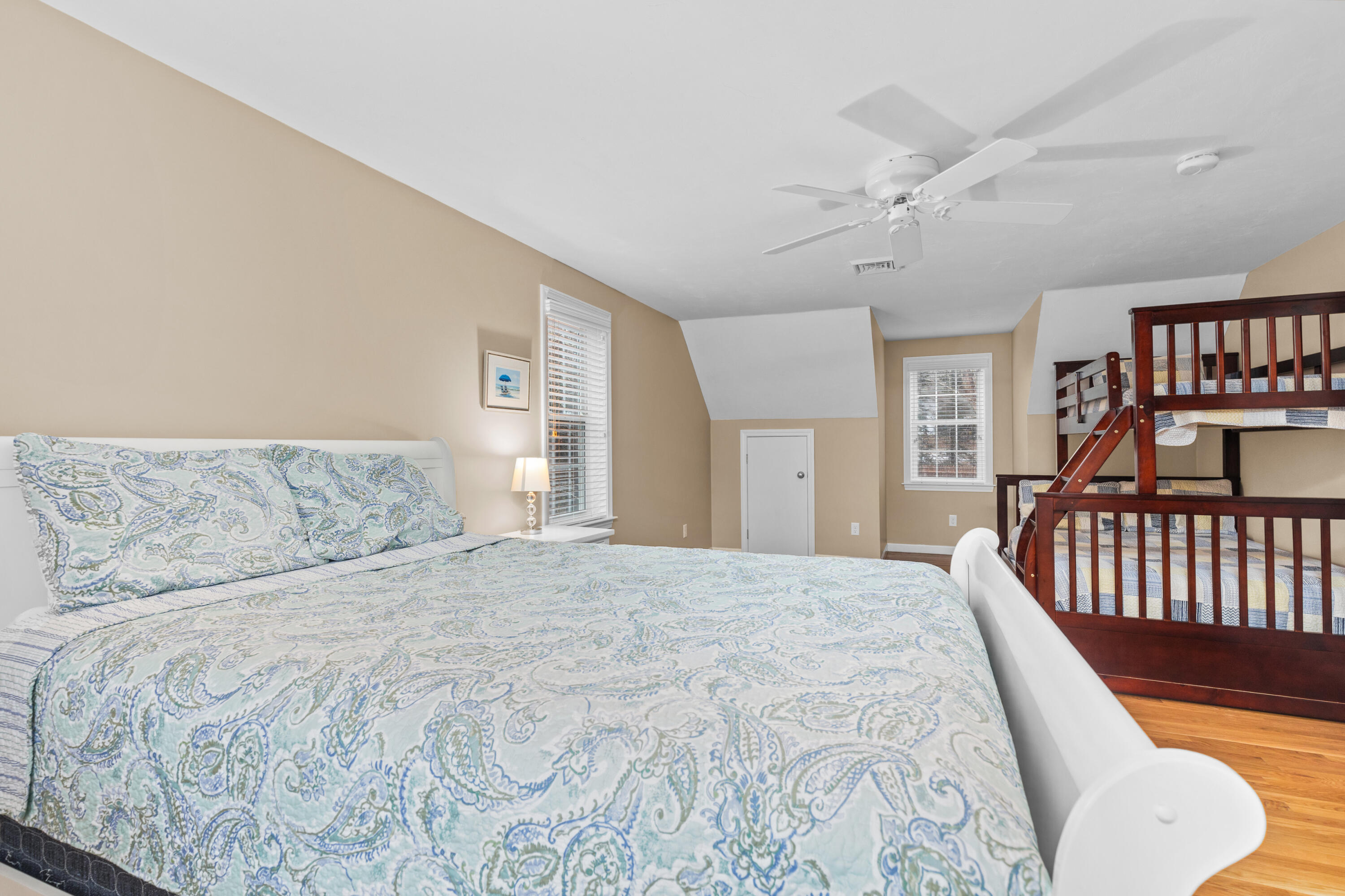 5 Baker Road Wellfleet, MA 02667 - Photo 22 of 30 a bedroom with a large bed and a book shelf