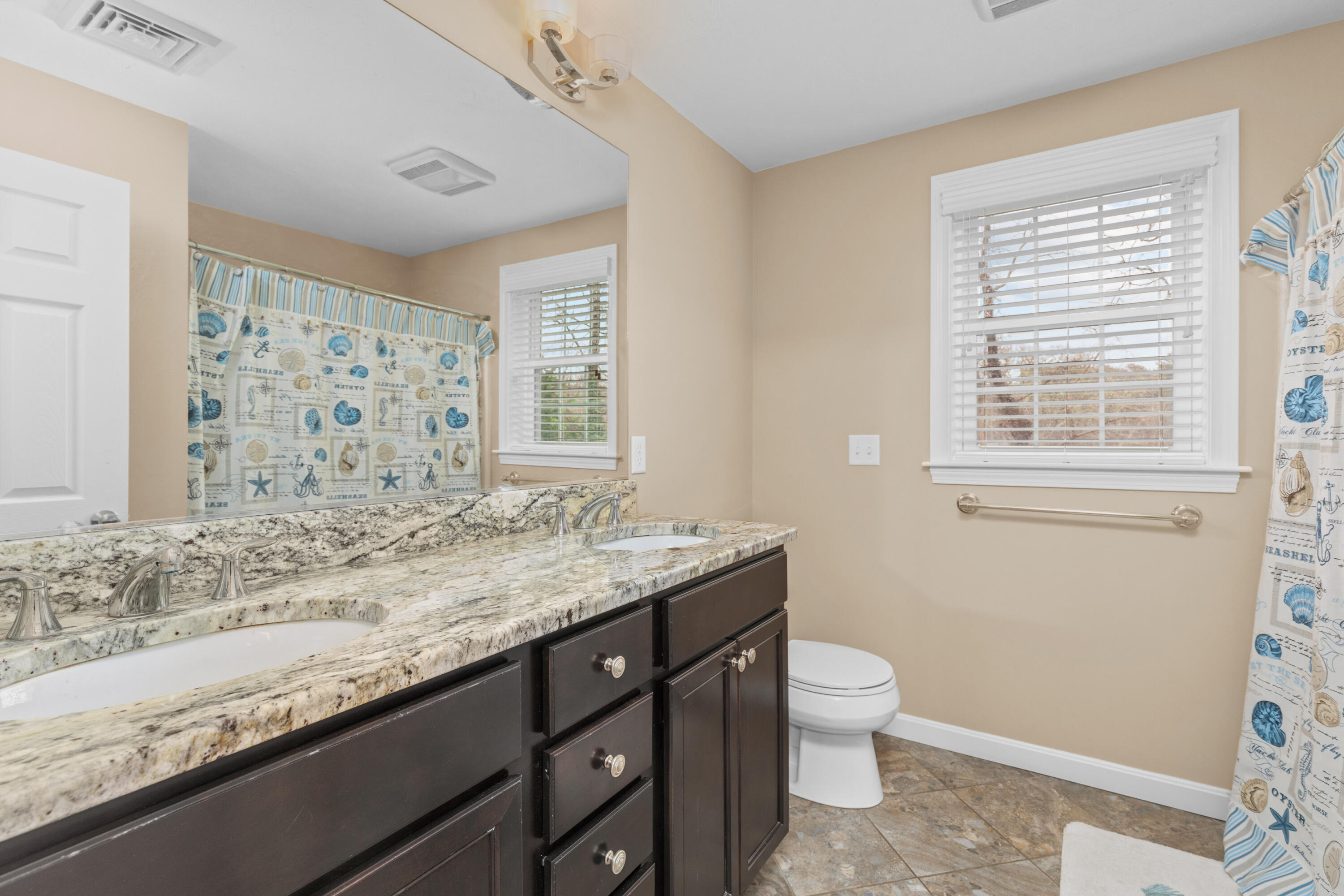 5 Baker Road Wellfleet, MA 02667 - Photo 24 of 30 a bathroom with a granite countertop sink toilet and shower