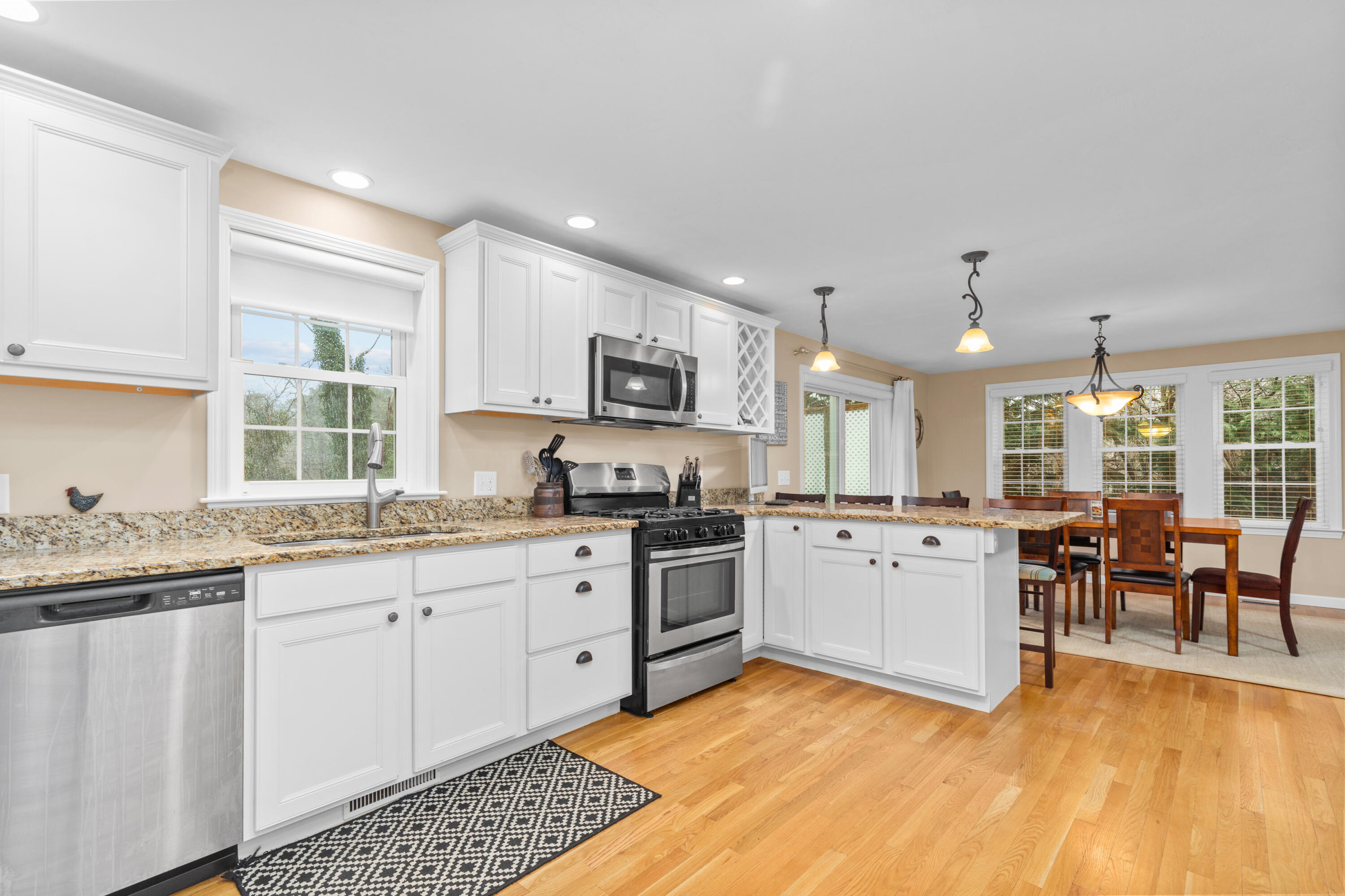 5 Baker Road Wellfleet, MA 02667 - Photo 4 of 30 a kitchen with a sink stove and cabinets